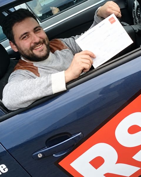 Learner with his pass certificate in an RSA School of Motoring car